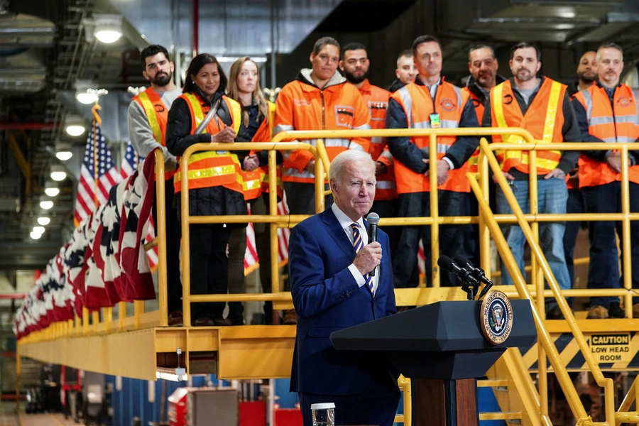 Rail workers watch at U.S. President Joe Biden touts infrastructure spending on the Hudson River Tunnel in New York City 